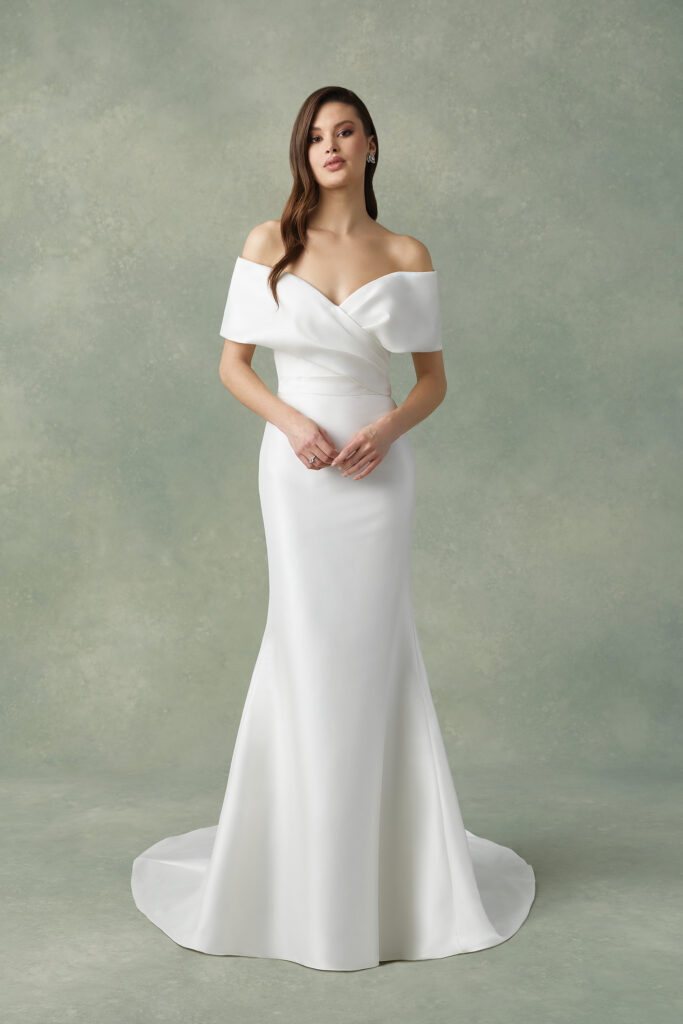 Simple, classic wedding dress with drop shoulders.